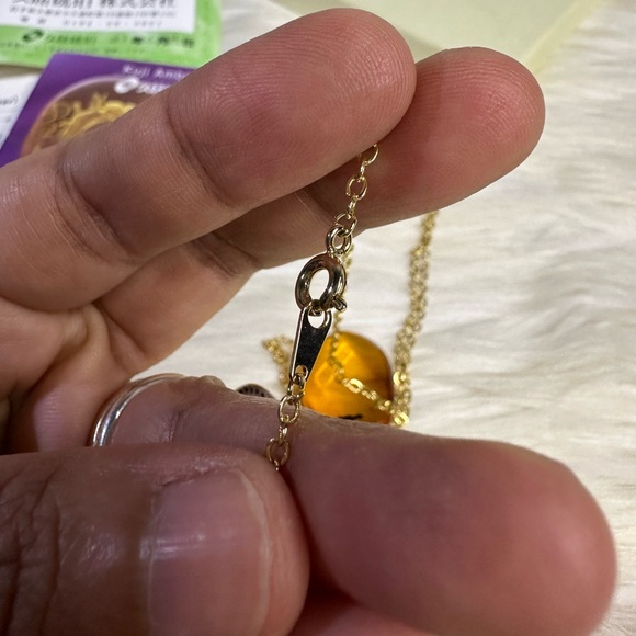 AMBER necklace in 18k gold and plated chain - Picture 7 of 17